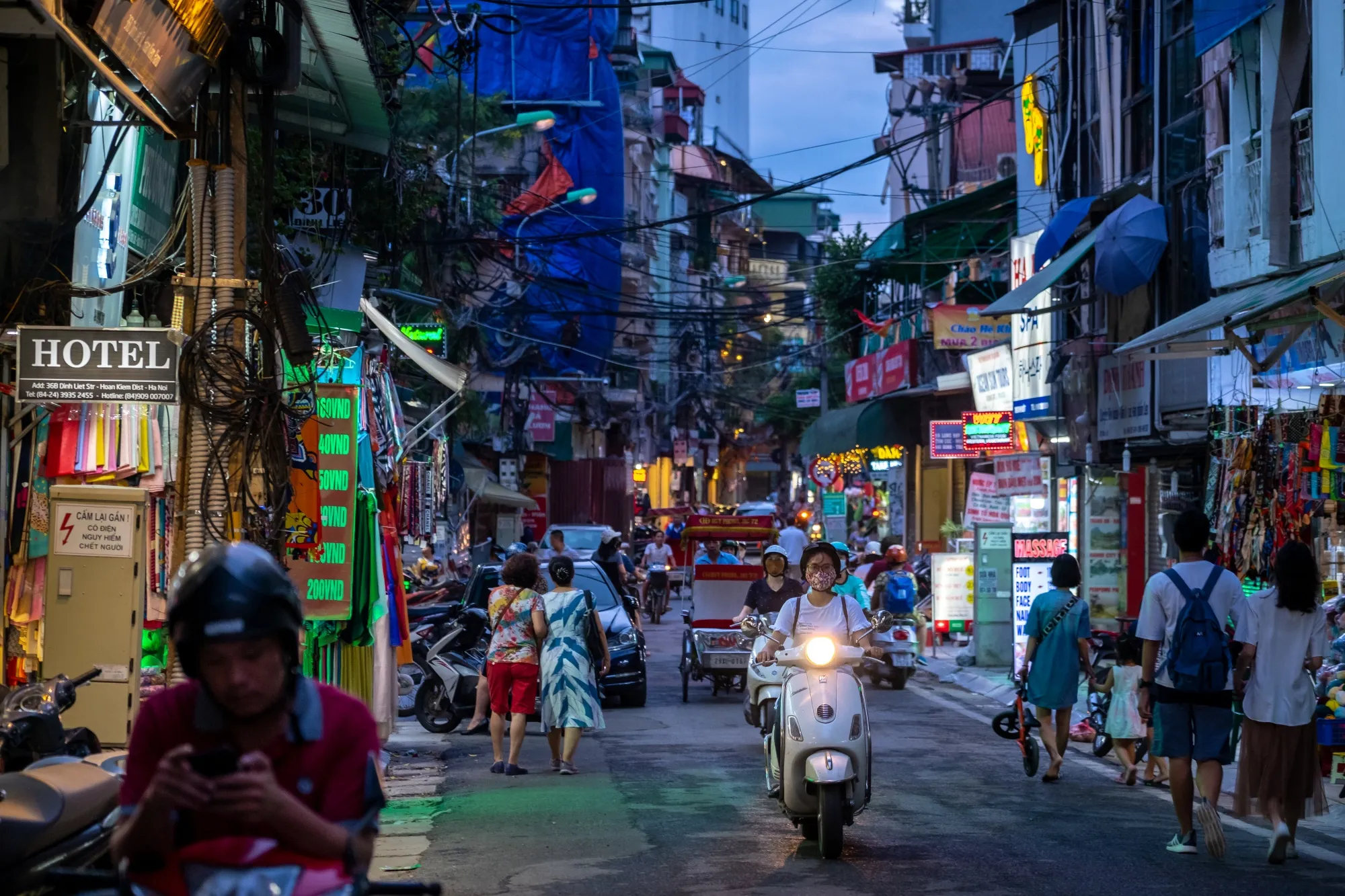 A motorcyclist wearing a protective masks travels along a road in Hanoi, Vietnam, on&nbsp;Sept. 18.