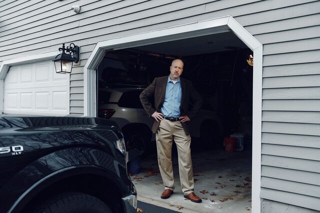 Image of Brian Cotter standing in his garage 