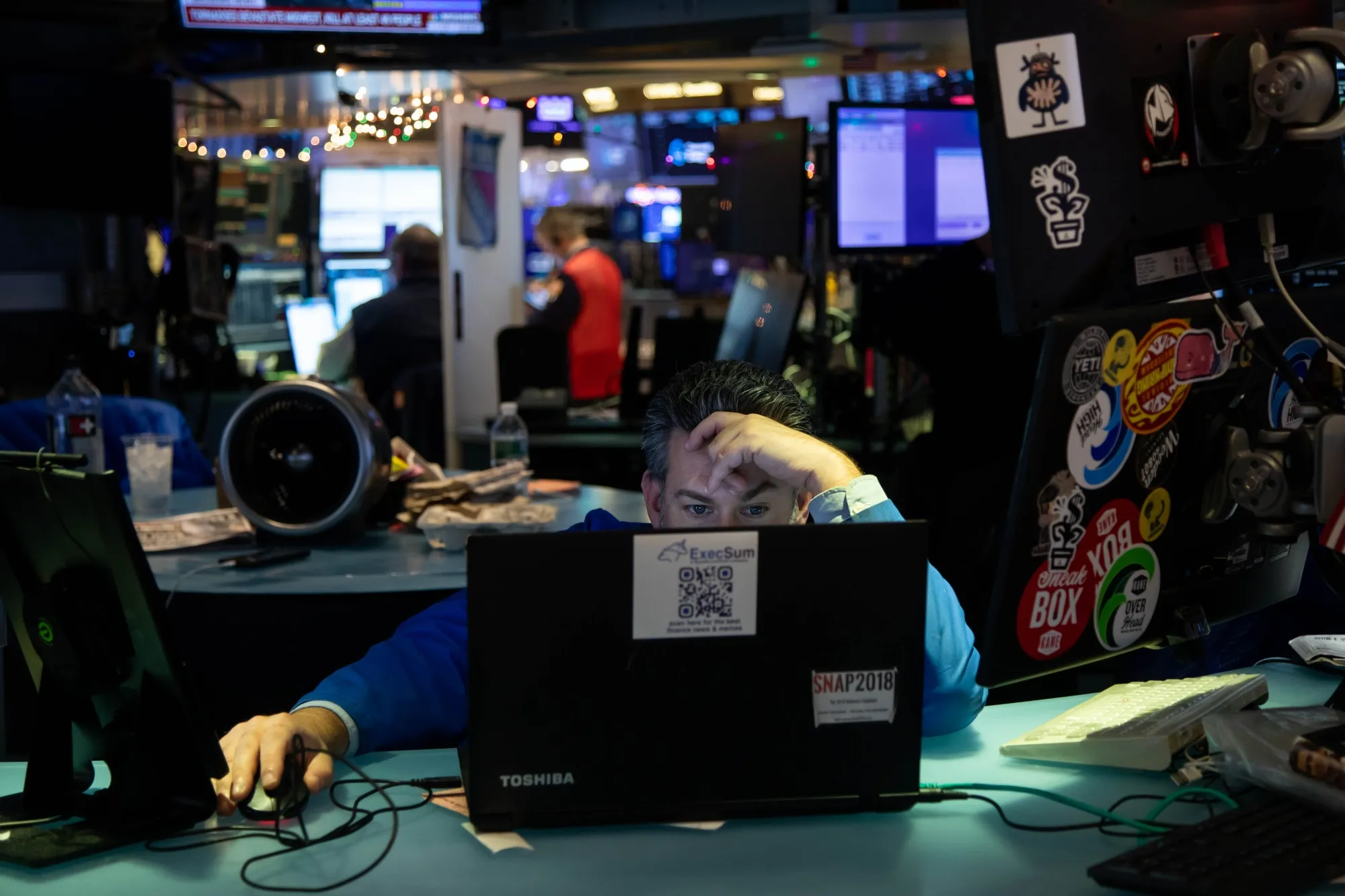A trader works on the floor of the New York Stock Exchange.