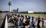 Travelers queue at Schiphol Airport on September 12.
