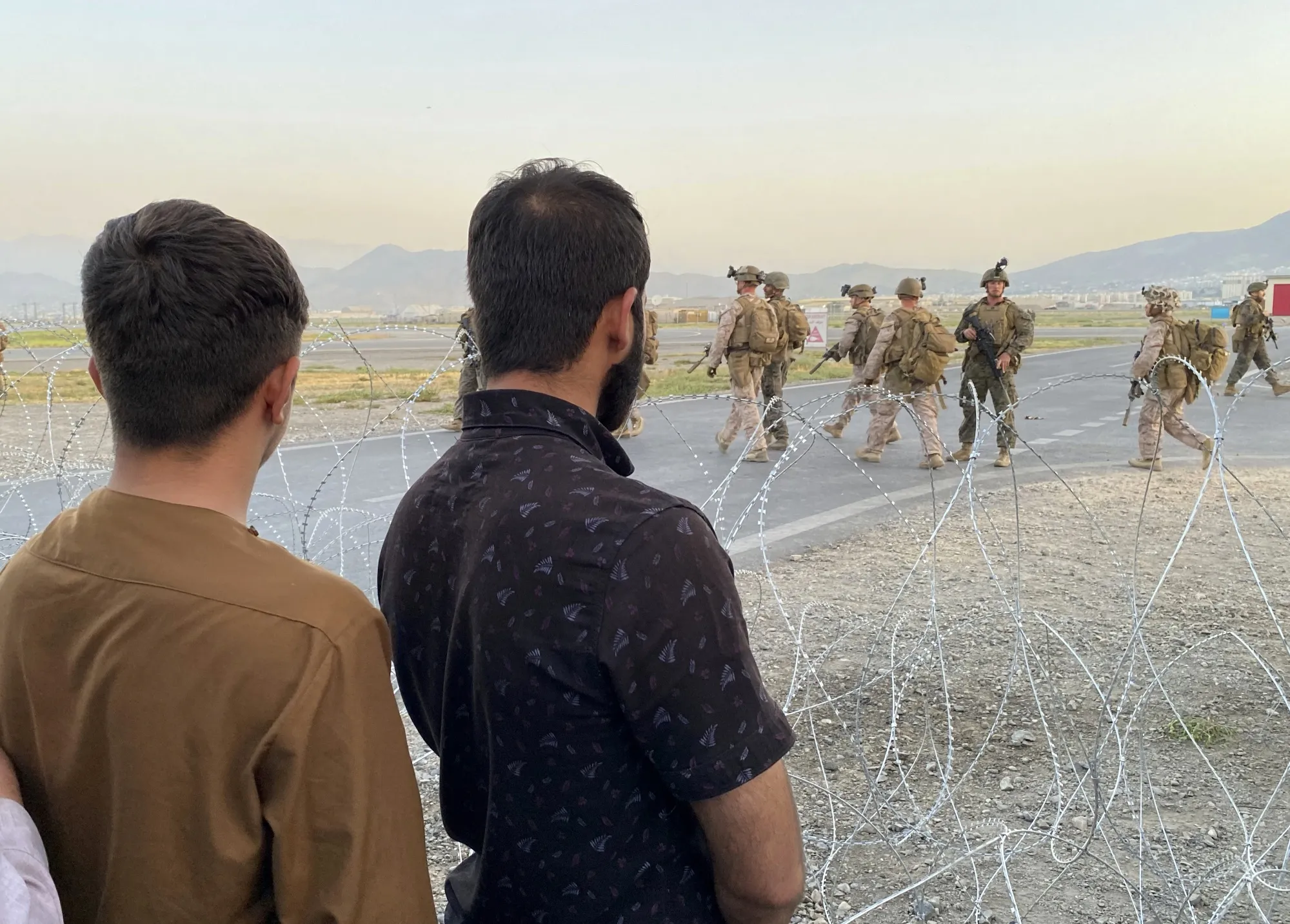 U.S. soldiers stand guard along a perimeter at the international airport in Kabul, on Aug. 16.