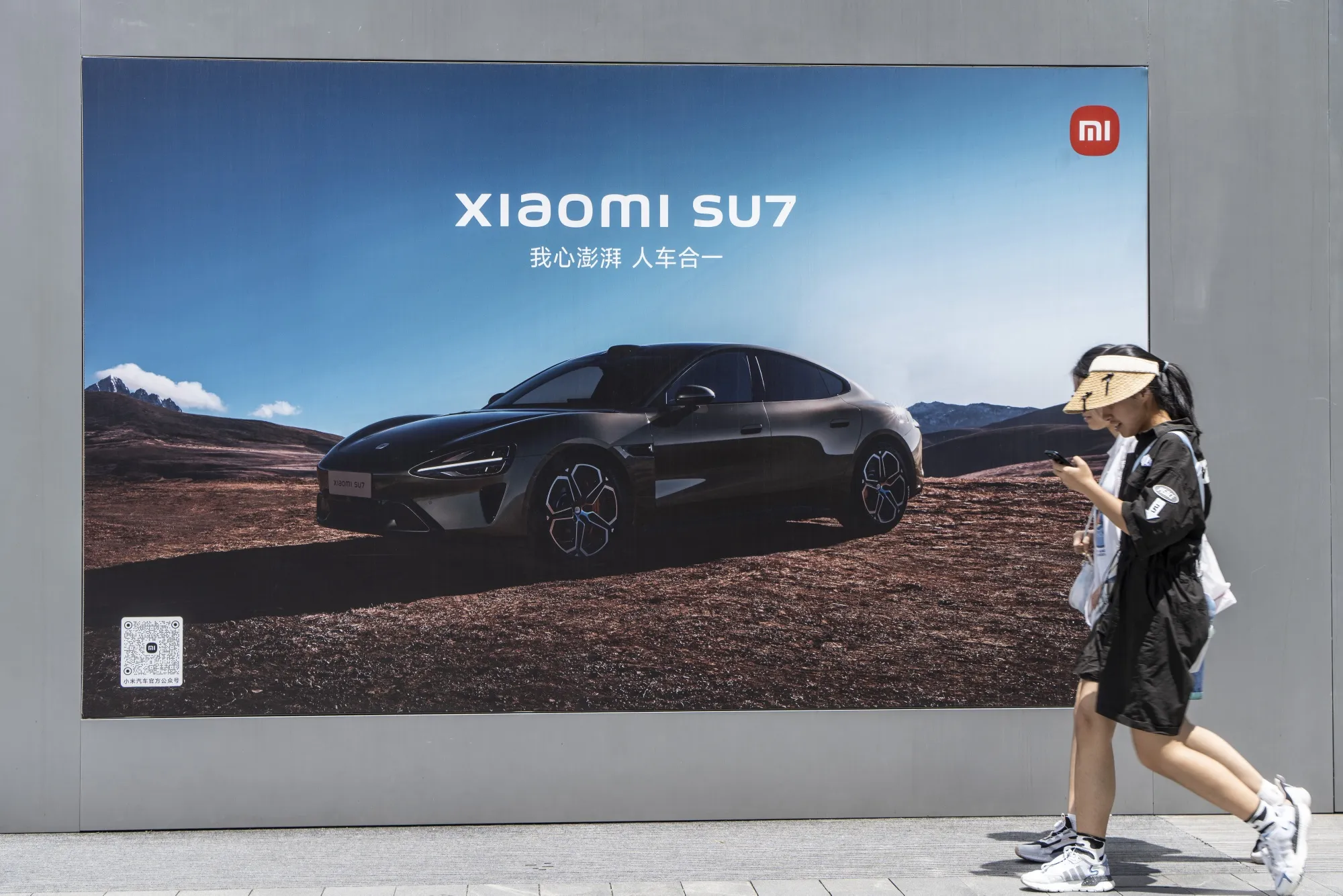 An advertisement for Xiaomi’s SU7 electric vehicle in Shanghai.