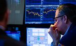 Traders work on the floor of the New York Stock Exchange.