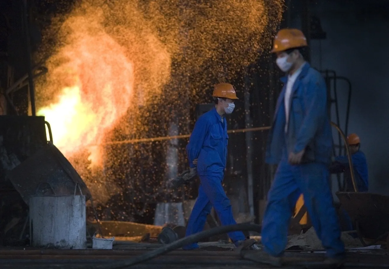 Metal workers work at the Tongling Nonferrous Metals Group Holdings Co. Ltd copper smelter in Tongling.