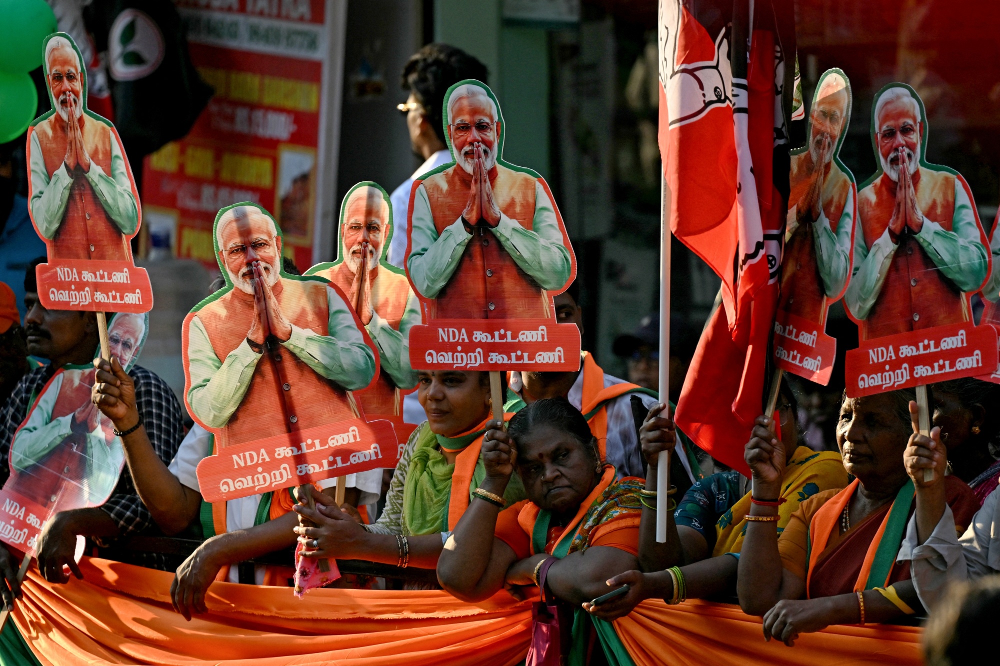 Bharatiya Janata Party (BJP) supporters carry cut-outs of party leader and India's Prime Minister Narendra Modi during a road show of the country's Home Affairs Minister and party leader Amit Shah, ahead of the 2026 Tamil Nadu Legislative Assembly elections in Chennai on April 19, 2026. (Photo by R. Satish BABU / AFP via Getty Images) Photographer: R. SATISH BABU/AFP