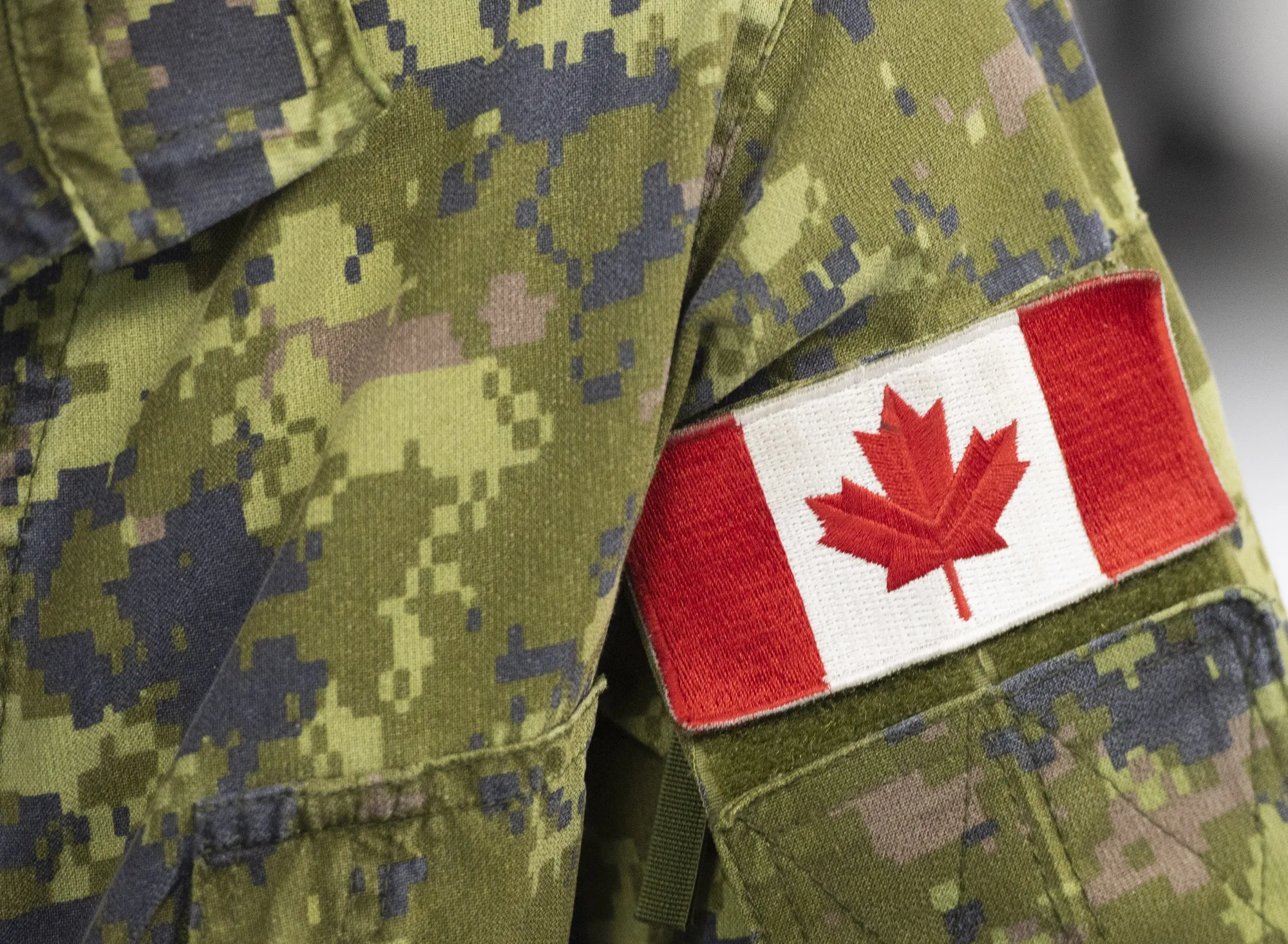 A Canadian flag on the sleeve of a member of the Canadian Armed Forces.