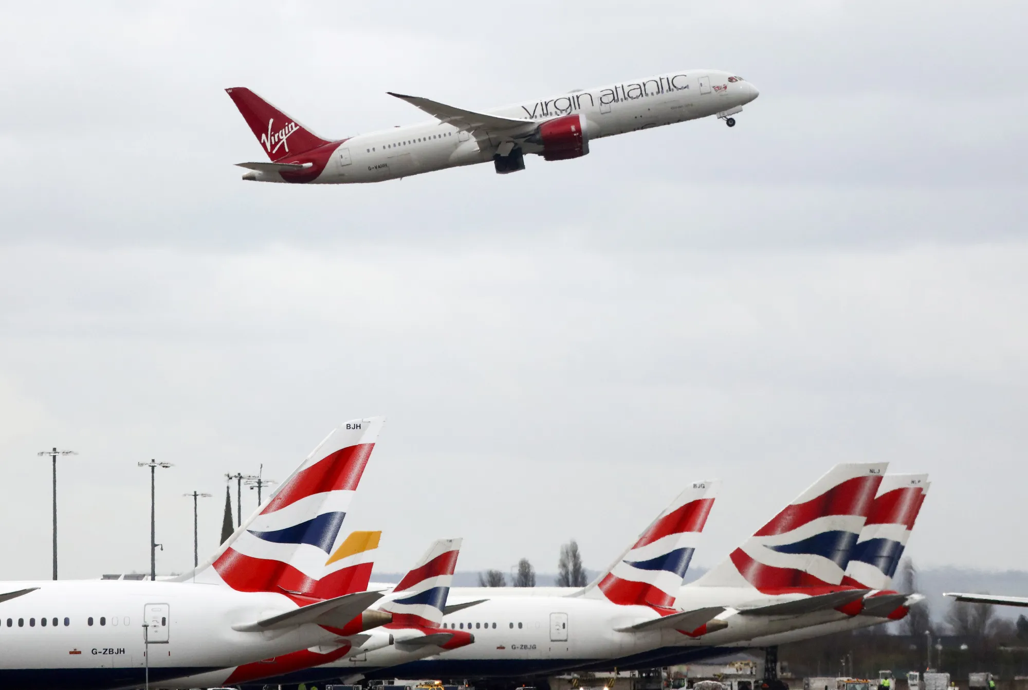Flights Operated By British Airways Carry Passengers At Heathrow Airport
