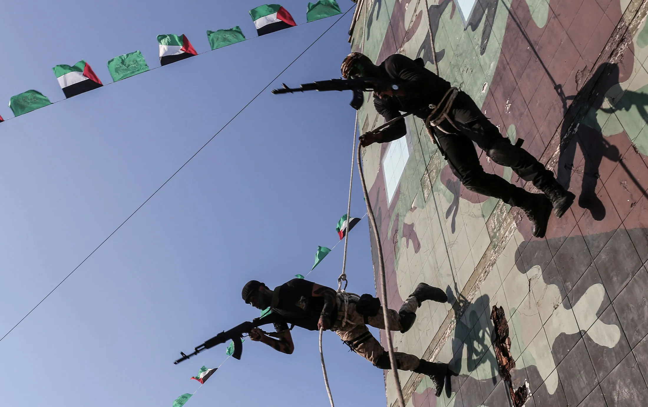 Young Palestinians abseil during a military graduation ceremony at a Hamas summer camp in Khan Yunis in the southern Gaza Strip on Aug. 18.
