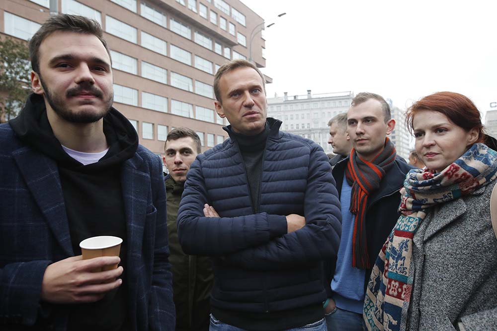 Alexei Navalny, centre, surrounded by members of his team, at a rally to support political prisoners in Moscow, Russia, Sept. 29, 2019.