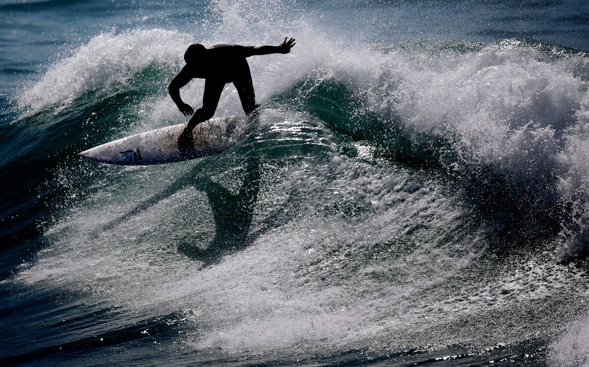 How Surfers Ride the Wave to the Next Economic Boom - Bloomberg