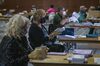Volunteers wearing protective masks and gloves sort through early voting ballots in Martinez, California, U.S., on Wednesday, Oct. 28, 2020.