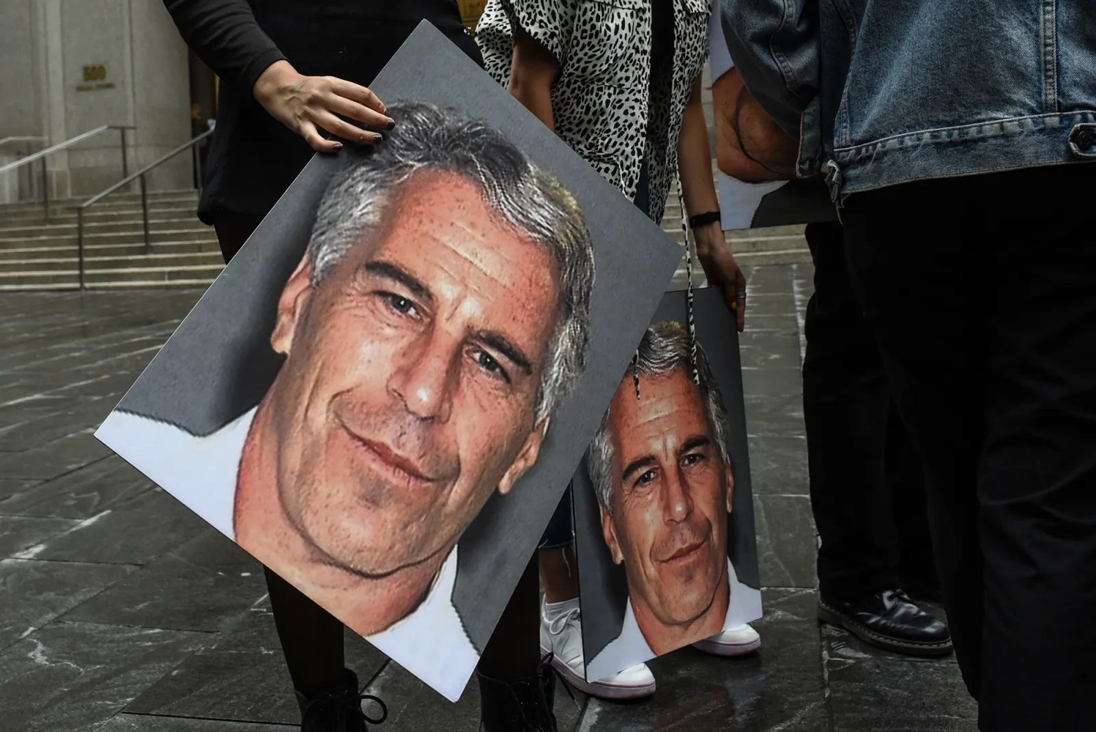 A protester holds an image of Jeffrey Epstein outside the federal courthouse in New York&nbsp;in 2019.