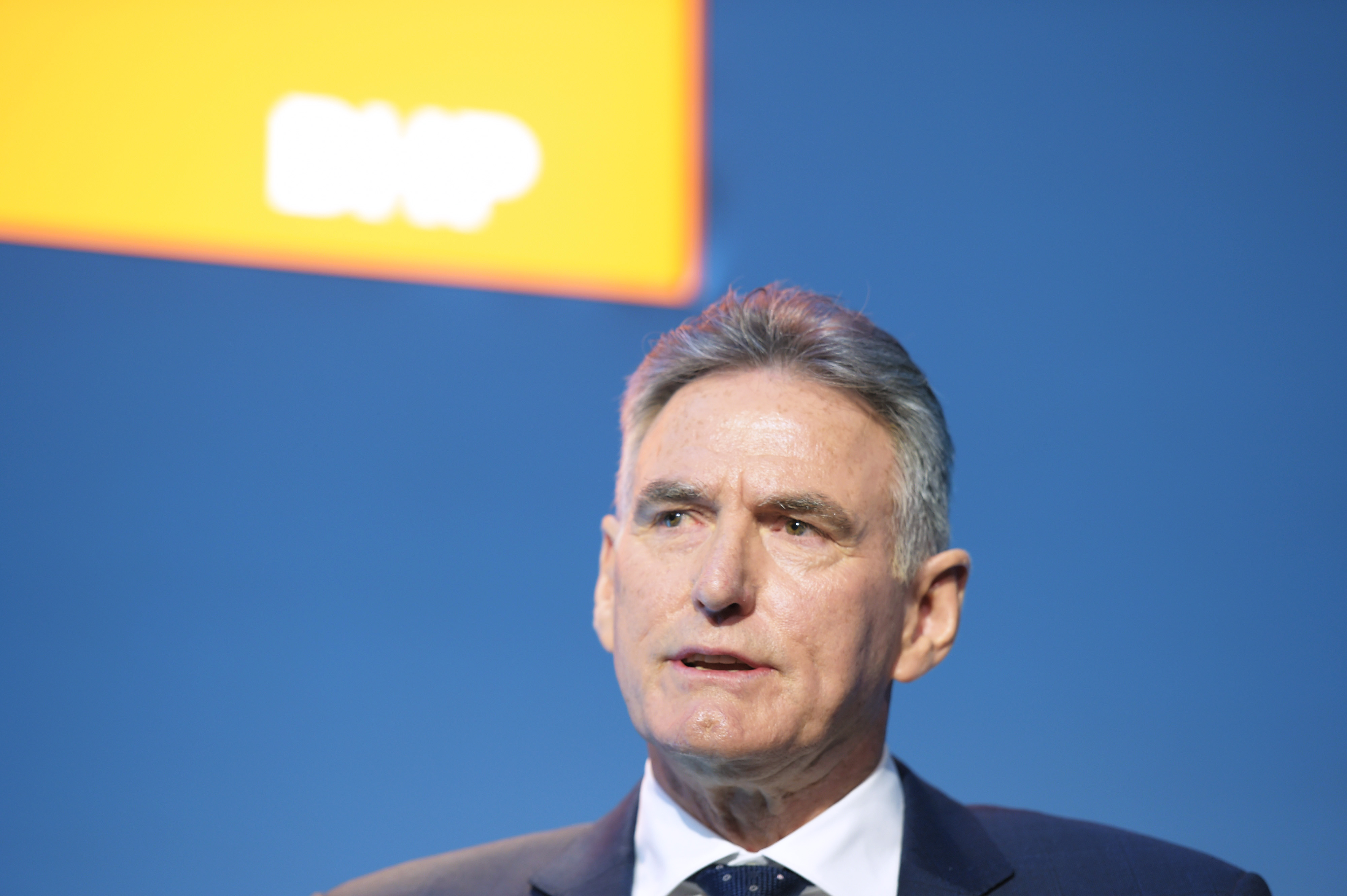 Ross McEwan, chair of BHP Group Ltd., speaks during the company's annual general meeting in Melbourne, Australia, on Thursday, Oct. 23, 2025. McEwan said the mining giant remained in commercial negotiations with China’s state-run iron ore buyer, noting that previous talks had taken as long as six months. Photographer: Carla Gottgens/Bloomberg