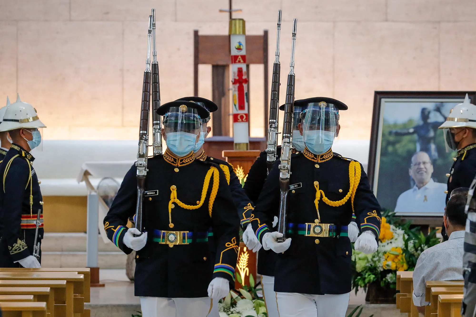 Military honour guards during a public viewing for Benigno Aquino at the Church of Gesu, Ateneo de Manila University in Manila on June 25.