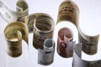 Japanese yen, U.S. dollar, and euro notes are arranged for a