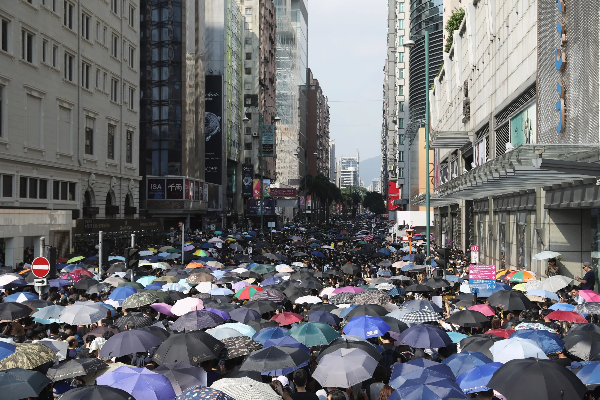 Demonstrators march along Nathan Road in Tsim Sha Tsui on Oct. 20.