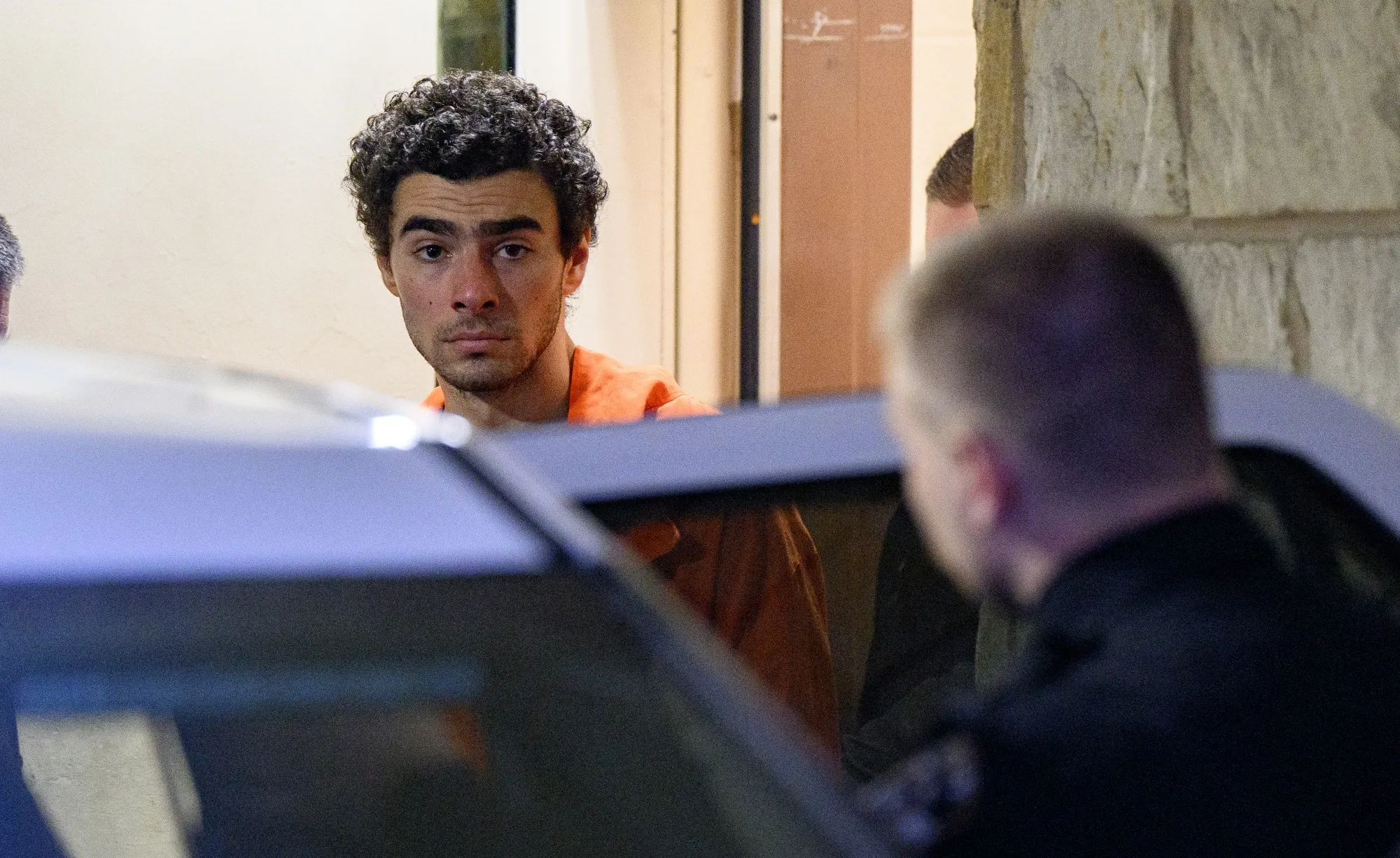 Suspected shooter Luigi Mangione is led from the Blair County Courthouse after an extradition hearing Dec. 10.