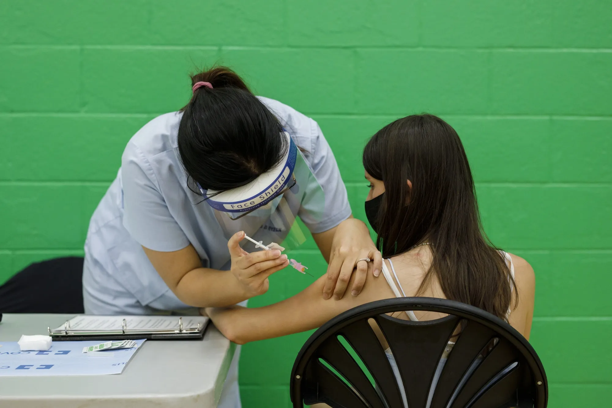 Adolescents Receive Covid-19 Vaccines At A Clinic 
