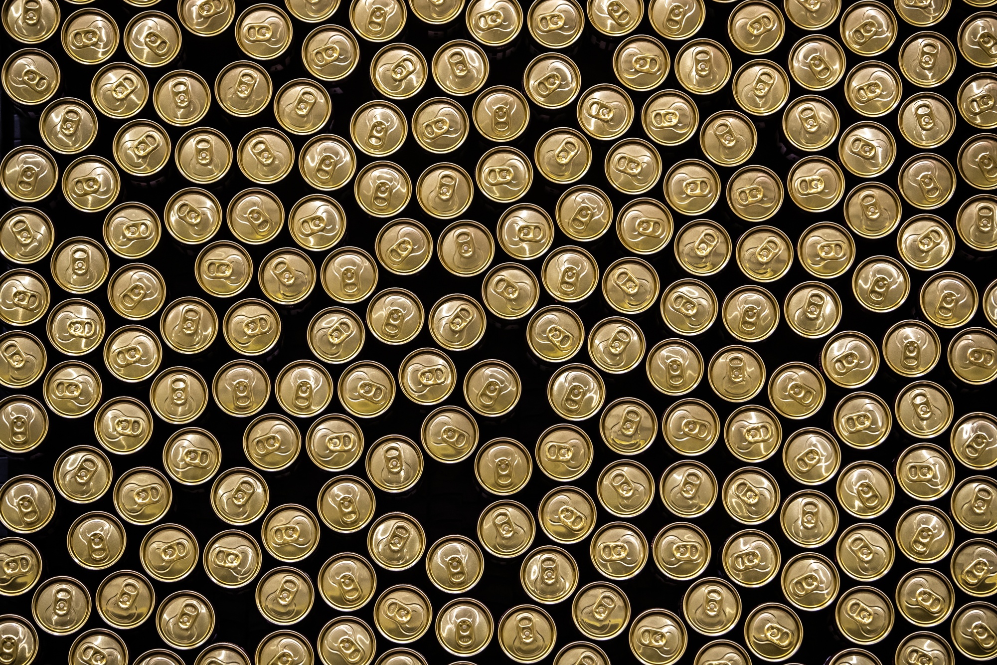 Cans of beer on the production line at the Ambev SA bottling facility in Sao Paulo, Brazil.