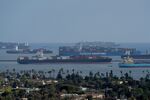 Container ships wait offshore at the Port of Long Beach in Long Beach, California, U.S.