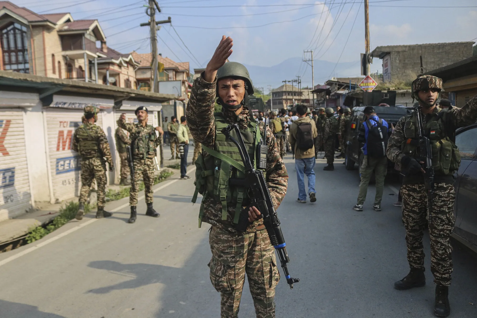 Indian soldiers guard a road south of Srinagar, Kashmir, on May 7.