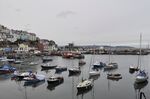 Boats are anchored in the fishing town of Brixham.