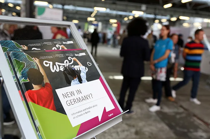 Information for new immigrants at an employment fair in Berlin.