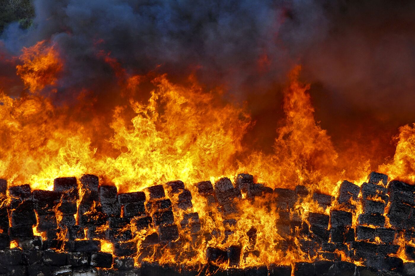Bundles of seized marijuana are incinerated at a military base in Tijuana.