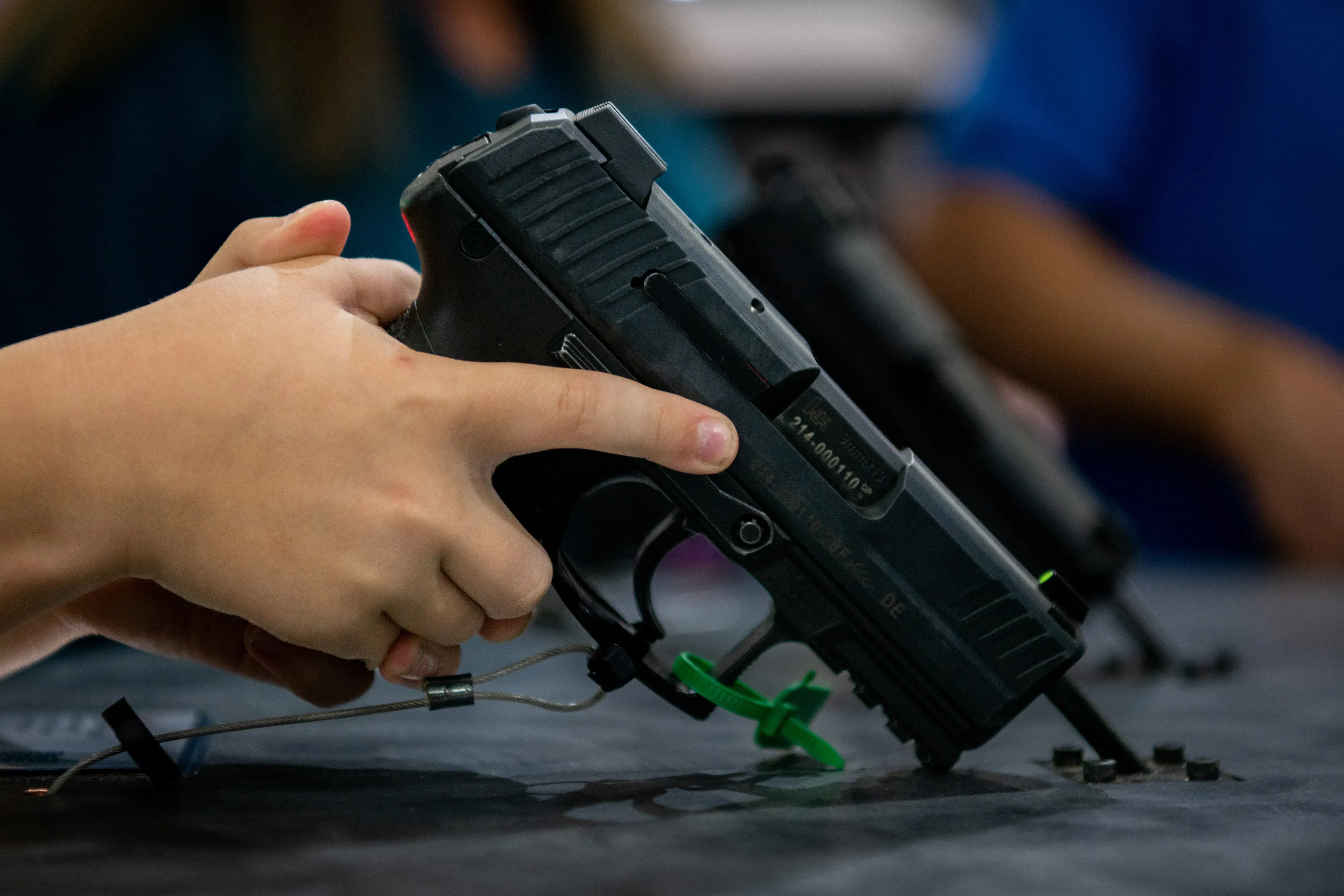 A child&nbsp;picks up a handgun&nbsp;in Houston, Texas.