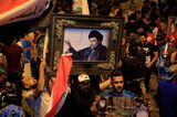 Supporters of Shiite cleric al-Sadr celebrate Election Results in Baghdad