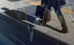 A businessman is reflected on an electronic stock board outside a securities firm in Tokyo, Japan.