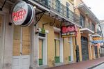 Boarded up restaurants along Bourbon Street in New Orleans on March 30, 2020.