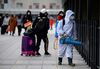 A worker disinfects the departure area of the Beijing railway station on Jan. 27.