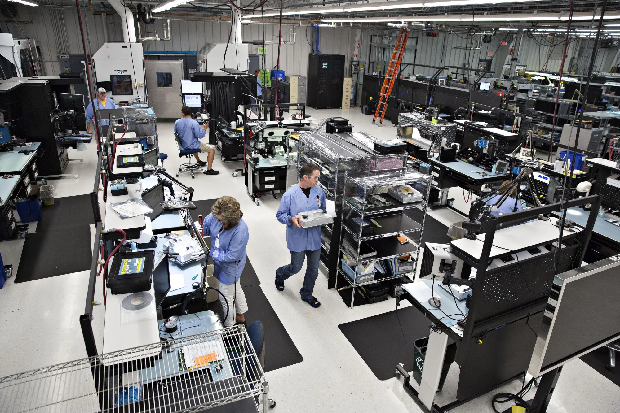 Workers at a Rockwell Collins Inc. production facility in Manchester, Iowa in 2016.
