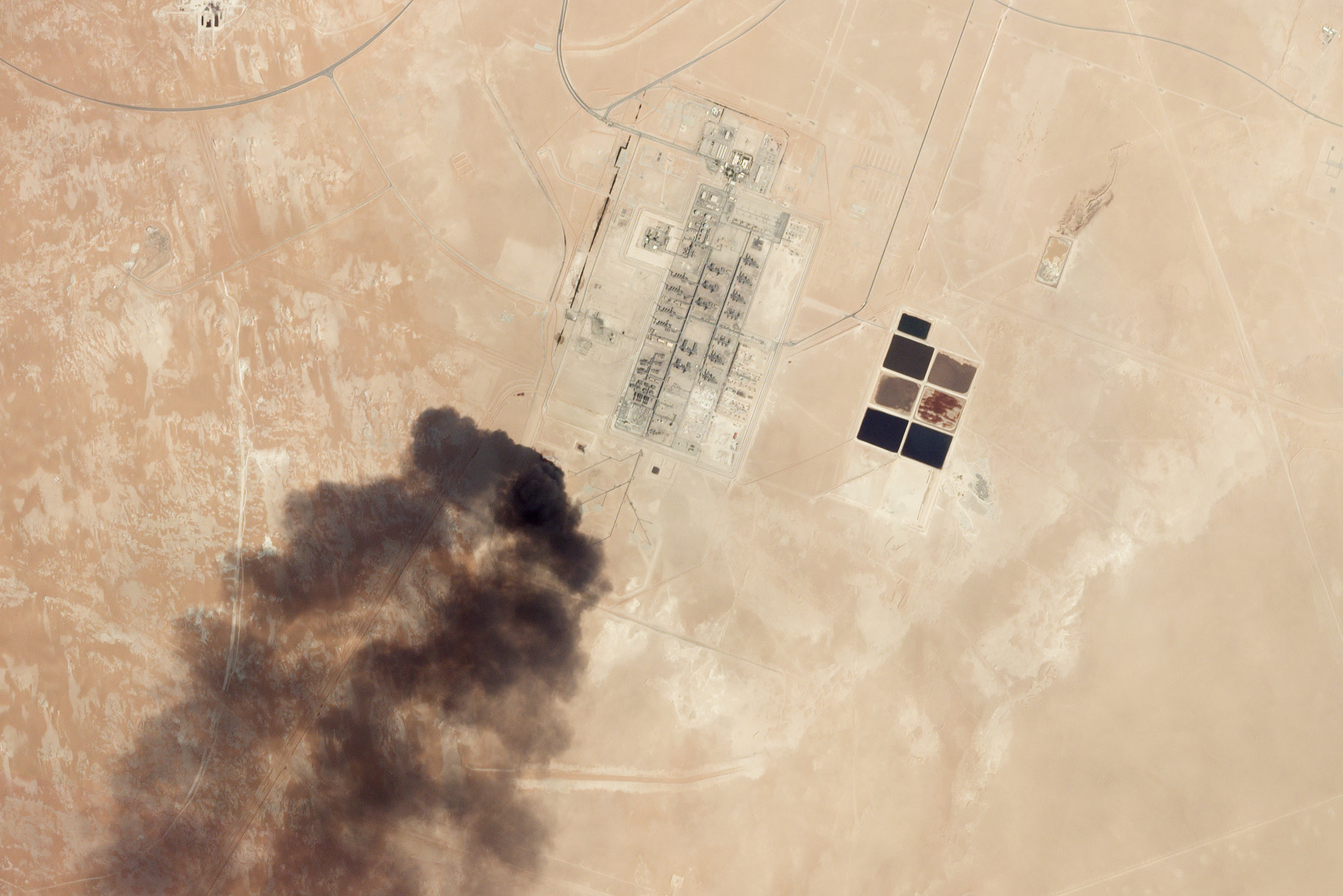 Satellite image showing smoke rising from the Abqaiq oil plant following a drone strike on Sept. 14.