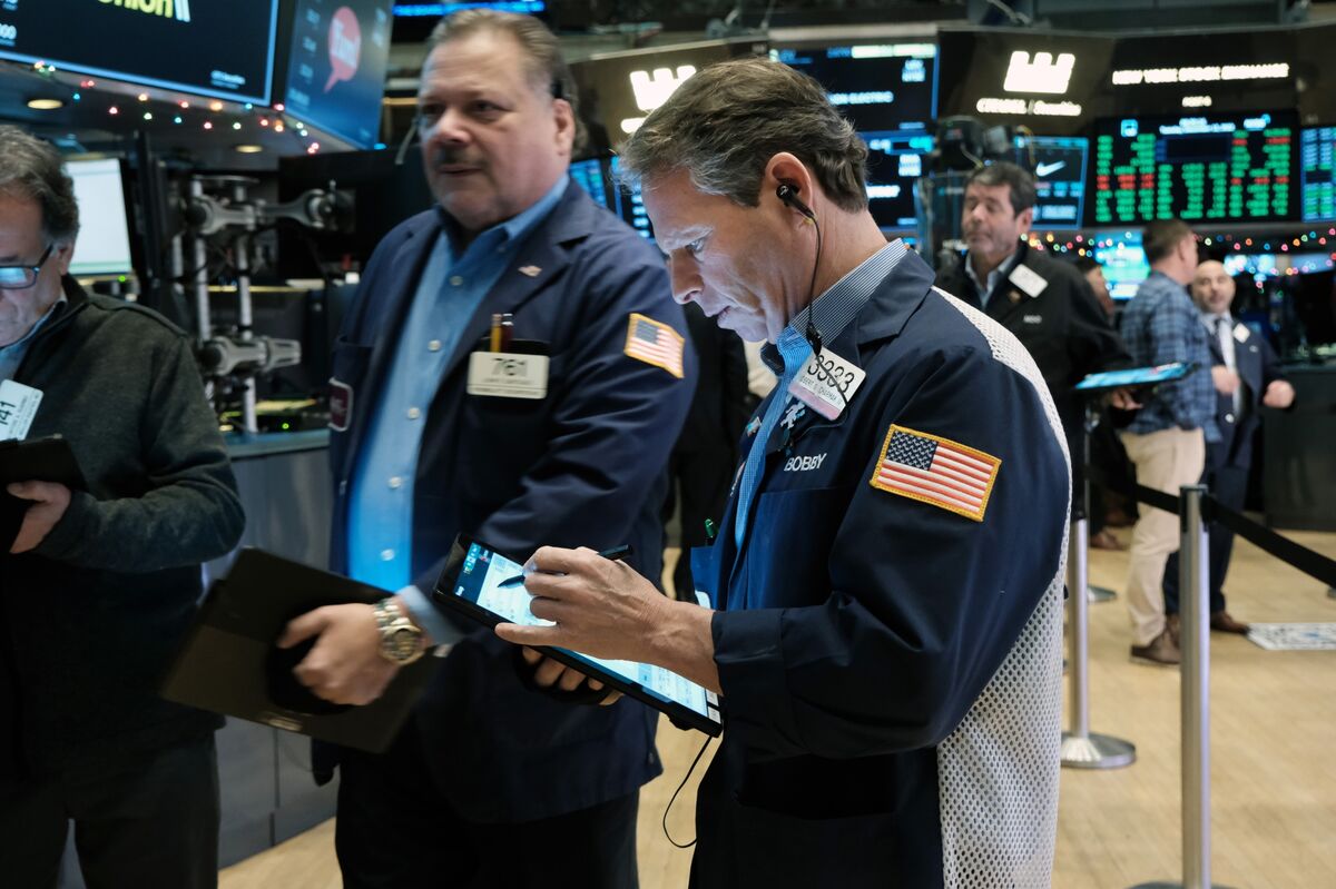 Traders work on the floor of the New York Stock Exchange.