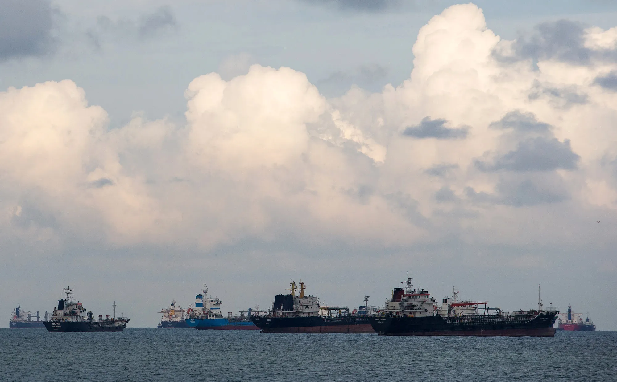Shipping vessels&nbsp;moored in waters off the southeastern coast of Singapore.