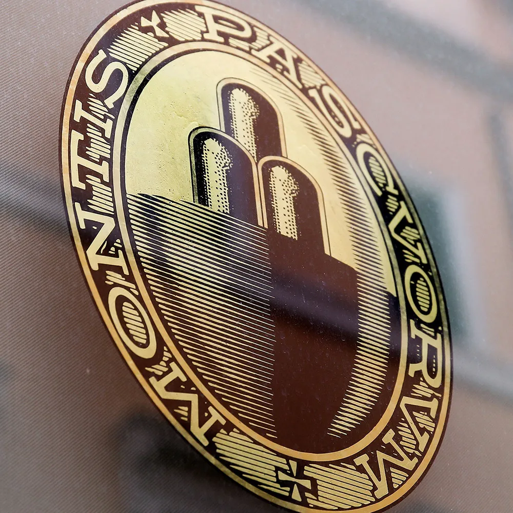 The Banca Monte dei Paschi di Siena SpA's logo sits on a window at one of the company's bank branches in Rome, Italy, on Wednesday, Jan. 27, 2016. Italy's banking woes are set to plague Prime Minister Matteo Renzi for months to come after a long-sought deal with the European Union on bad debts disappointed investors.
