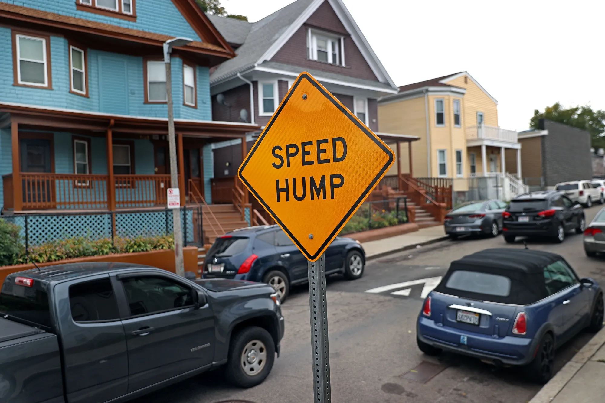 A speed hump warning sign on Claybourne Street in Boston, where the city’s deployment of speed control infrastructure has drawn complaints from drivers.&nbsp;&nbsp;
