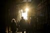 Pedestrians walk along a street near the New York Stock Exchange (NYSE) in New York, U.S., on Thursday, Dec. 27, 2018. Volatility returned to U.S. markets, with stocks tumbling back toward a bear market after the biggest rally in nearly a decade evaporates.