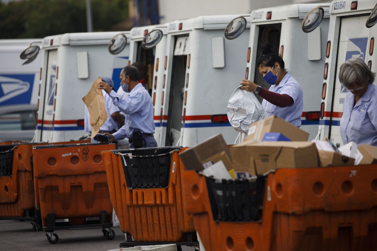 USPS Postmaster General DeJoy Says He'll Suspend Changes Until After