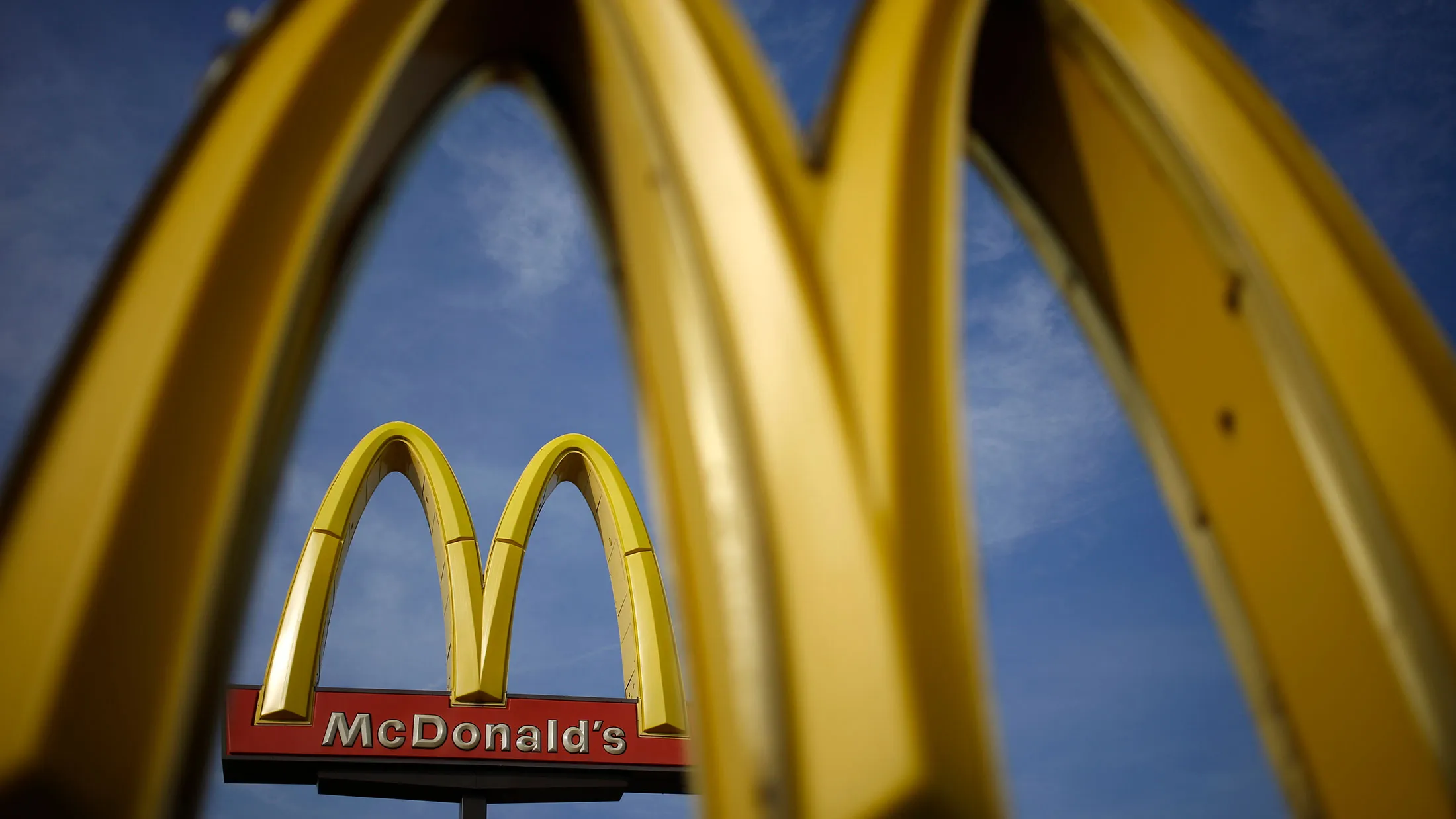 Signage stands outside a McDonald's Corp. fast food restaurant in Bowling Green, Kentucky, on Jan. 18, 2017.
