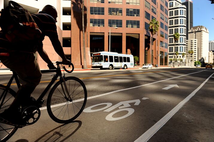 A byclist rides down the new commuter bike lane on 7th St. in Downtown Los Angeles.