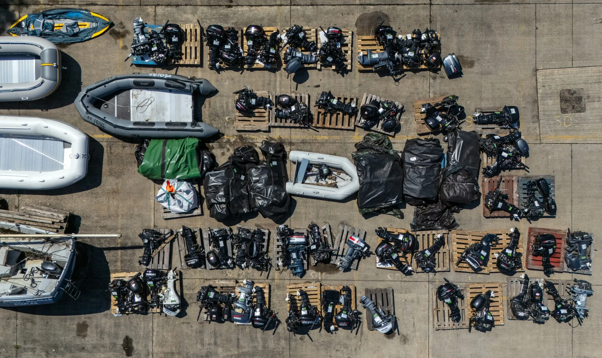 Inflatable dinghies and outboard motors believed to have been used by illegal migrants to cross the English channel to England, in Dover.