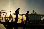Crew men board the oil tanker 'Devon' in preparation for transporting crude oil to export markets in Bandar Abbas, Iran.