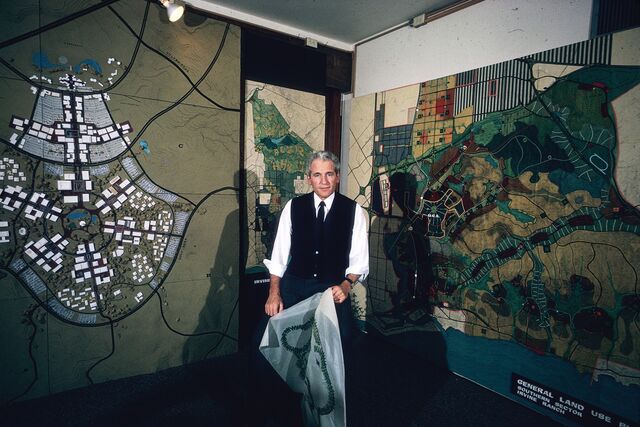 Archival photo from the 1960s of William Pereira with a model of UC Irvine’s campus