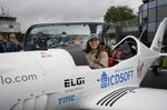 Zara Rutherford waves from her Shark ultralight plane prior to take off at the Kortrijk-Wevelgem airfield in Wevelgem, Belgium. 