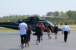 Passengers prepare to board a helicopter at East Hampton Airport&nbsp;in 2017.