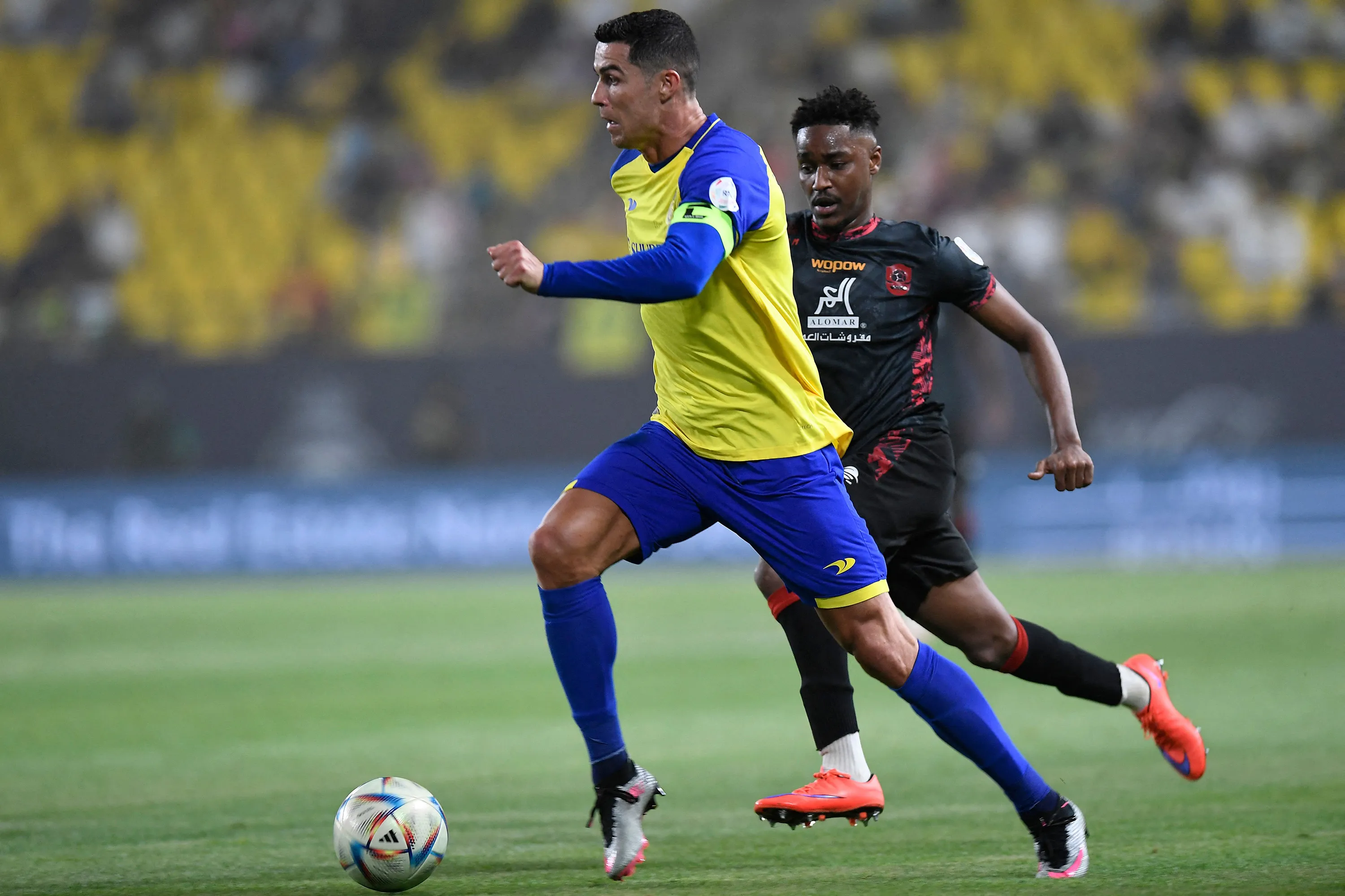 Cristiano Ronaldo, left, during the Saudi Pro League football match between Al-Nassr and Al-Raed in Riyadh on April 28.