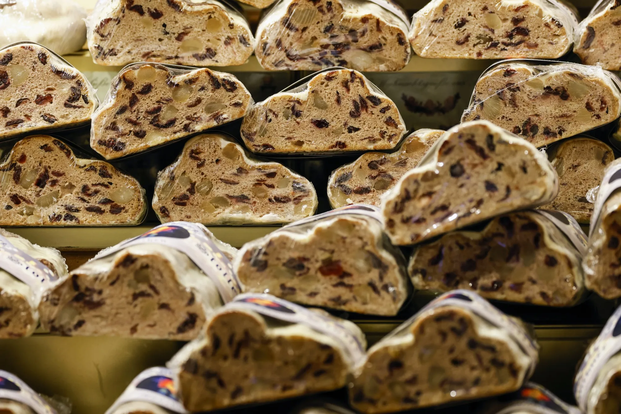 Stollen fruit bread on sale at a confectionery stall in the Christmas market.